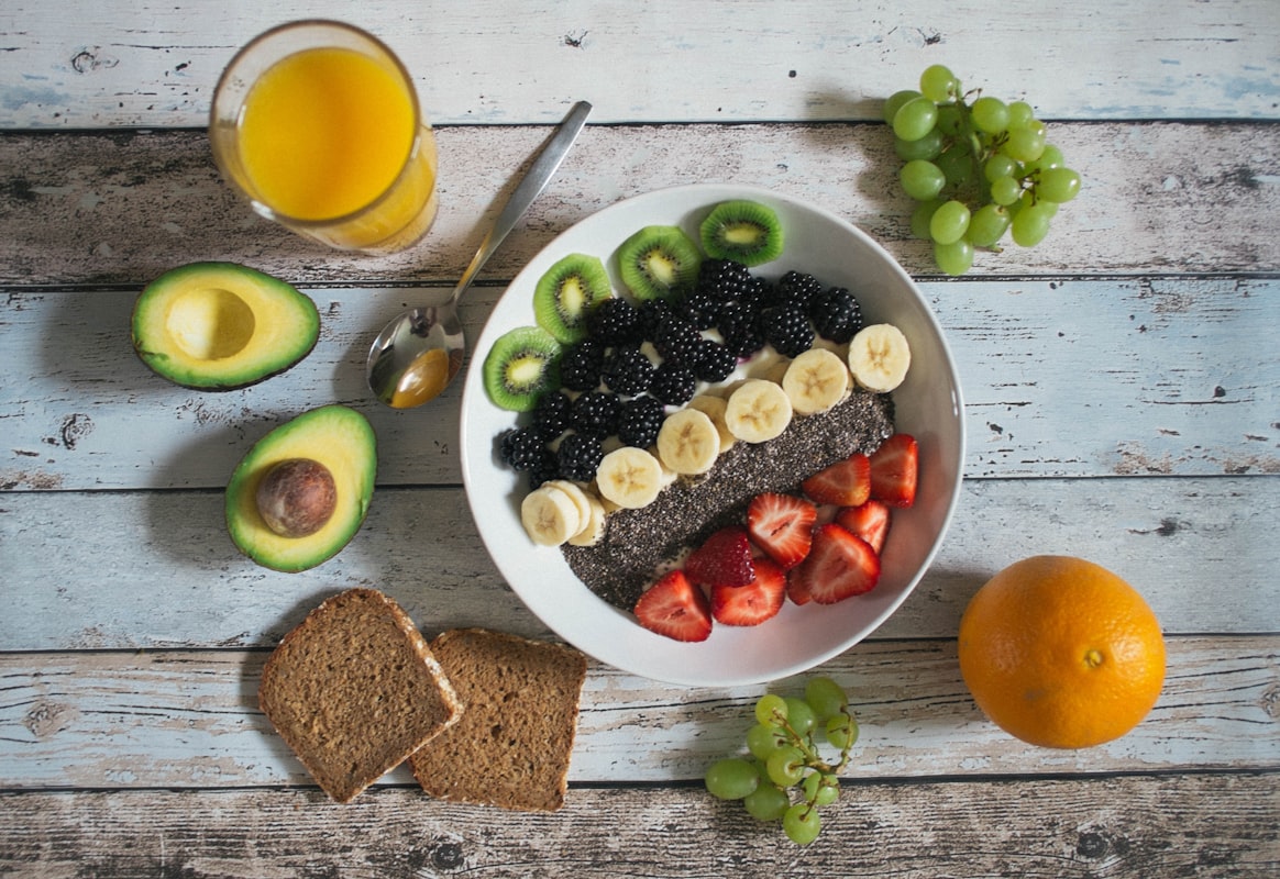 Colorful breakfast bowl with berries, nuts, and yogurt